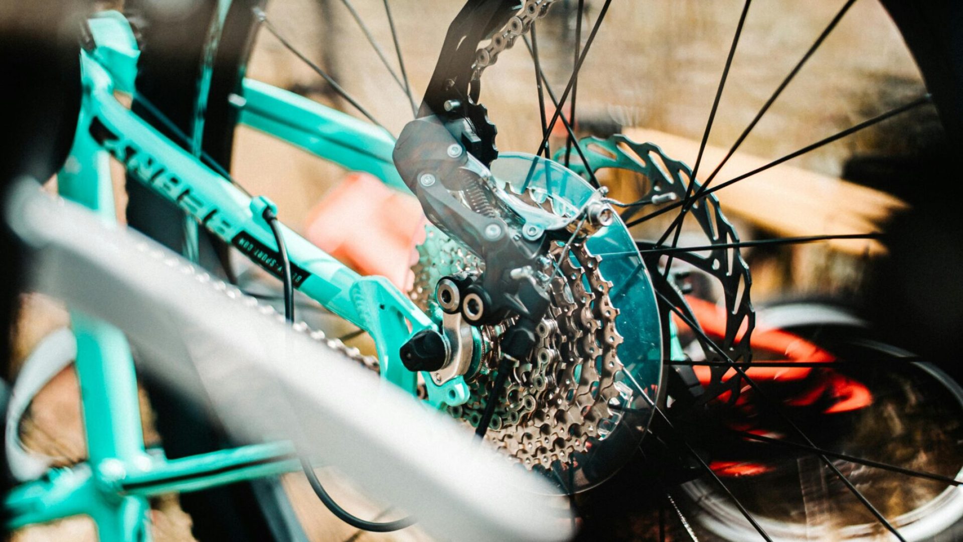 Detailed shot of a mountain bike's gear system, highlighting motion and sport outdoors.